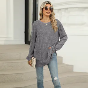 Close-up of women's gray ribbed knit long sleeve top with pockets and crewneck