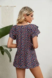 Back view of floral print V-neck top with double-layer ruffle sleeves in a relaxed fit.