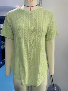 Detailed view of light green textured jacquard short sleeve T-shirt on mannequin