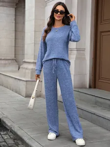 Detailed view of women's blue ribbed knit loungewear set with long sleeve top and pants