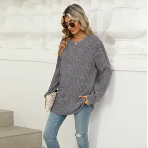 Detailed visual of the casual grey round neck top featuring functional side pockets.
