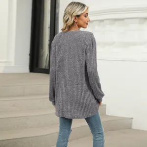 Back view of a comfortable grey ribbed knit top with long puff sleeves and a casual loose fit