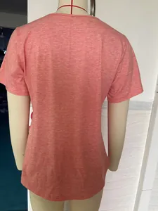 Back view of a coral pink short-sleeved loose t-shirt on a mannequin