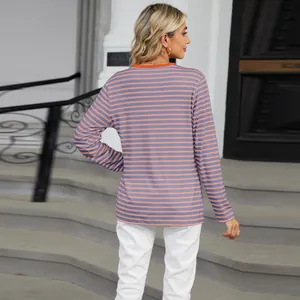 Back view of a striped long sleeve T-shirt with orange contrast collar and loose fit