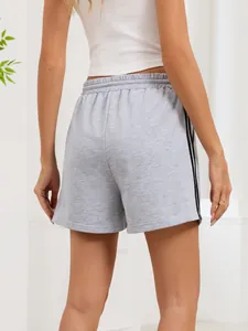 Back view of grey casual sport shorts with black side stripes in a soft knit fabric