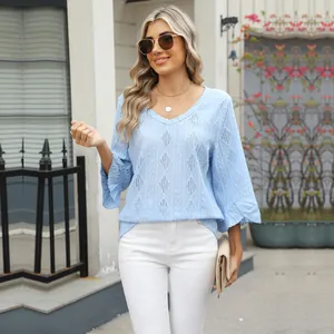 Stylish light blue V-neck top with diamond pointelle knit texture and bell sleeves