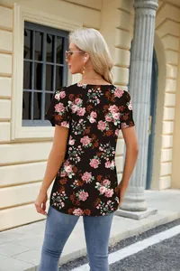 Back view of a black floral print t-shirt featuring a square neck and petal sleeves