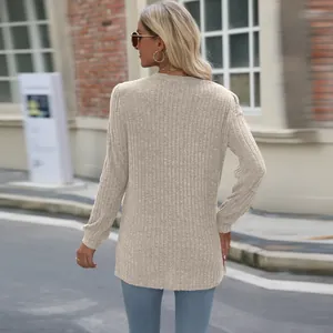 Back view of a chic beige long-sleeve ribbed top with casual loose fit for women's autumn style