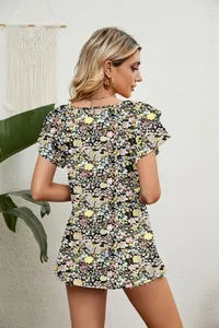 Detail view of the back of a summer floral print top with double ruffle flutter sleeves.
