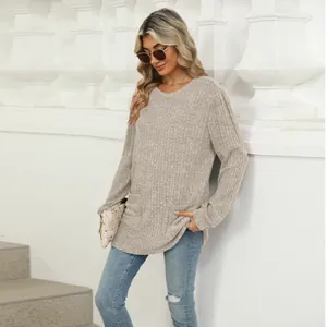 Casual round neck ribbed knit top with long sleeves and side pockets in beige color