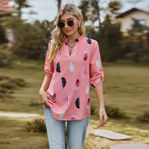 Casual pink V-neck blouse with colorful feather print and 3/4 length roll-tab sleeves
