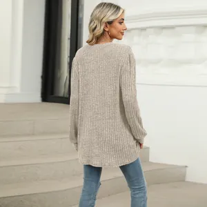 Rear view of women's casual beige ribbed long sleeve top with loose bubble sleeves