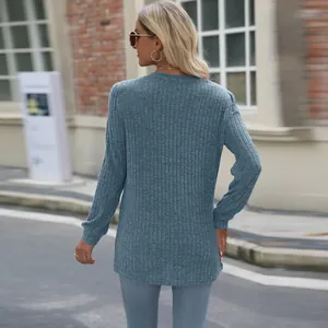 Back view detail of a stylish blue casual ribbed long sleeve top with puff sleeves for women