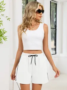 Detail view of white casual sports shorts with black drawstring and side stripes