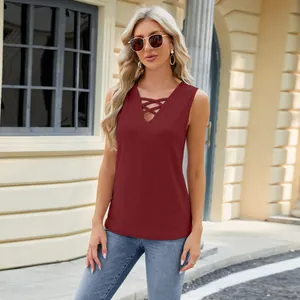 Sleeveless burgundy V-neck top with criss-cross straps and jacquard pattern on a model