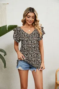 Detail view of a floral V-neck top with double-layer ruffle sleeves on a model.