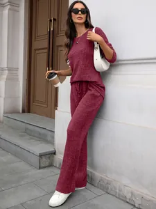 Fashionable wine red ribbed knit loungewear set featuring long sleeve top and wide pants