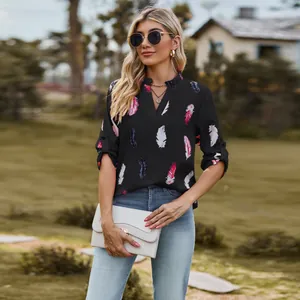 Elegant women's V-neck black shirt with colorful feather print and loose 3/4 sleeves
