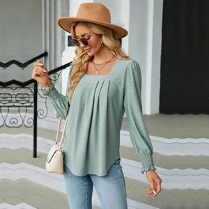 Detailed view of women's mint green jacquard blouse featuring elegant square neck and pleats