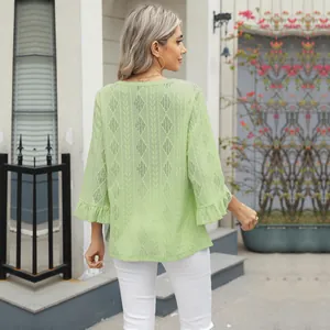 Detailed back view of a light green hollow jacquard V-neck T-shirt with ruffled bell sleeves