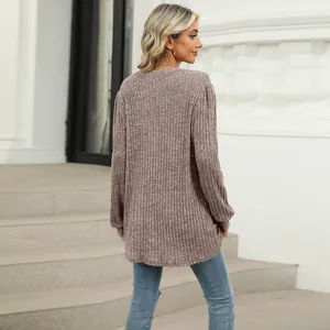 Back view of a casual dusty rose ribbed knit top with puff sleeves and loose crew neck fit.