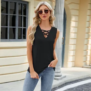 Detailed shot of black sleeveless V-neck top with criss-cross lace-up and jacquard fabric