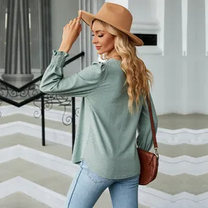 Stylish sage green long sleeve jacquard top with ruffled details shown from back