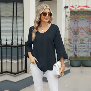 Detailed view of women's black V-neck t-shirt with diamond hollow jacquard and flare sleeves