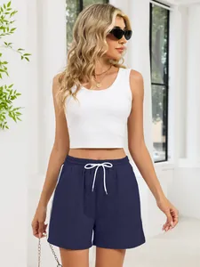 Detailed view of navy blue athletic shorts featuring white drawstrings and side stripes design
