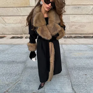 Elegant long black woolen coat featuring premium brown faux fur collar and cuffs detail.