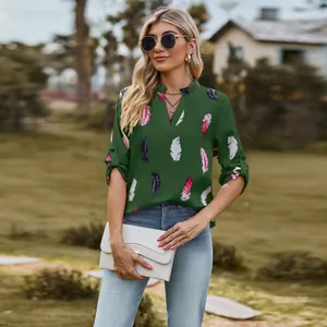 Elegant dark green V-neck blouse featuring a colorful feather print and 3/4 rolled sleeves