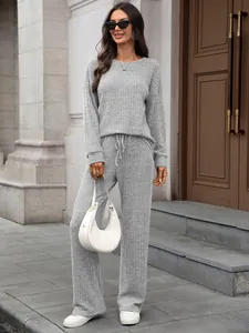 Cozy grey ribbed knit loungewear set featuring round neck long sleeve top and wide pants