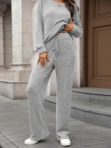 Close-up view of gray ribbed knit loungewear set showing brushed fabric texture and fit