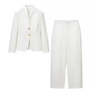 Elegant women's white two-piece suit set featuring a V-neck blazer with gold buttons
