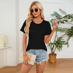 Detail of black round-neck t-shirt featuring elegant shirring on the chest.
