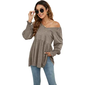 Elegante top peplum con scollo a V, maniche a sbuffo e polsini elastici per donna