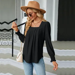 Elegant black square neck blouse with long sleeves and delicate jacquard texture