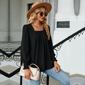 Detailed view of women's black square neck jacquard pleated long sleeve top with texture