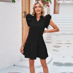 Elegant black sleeveless dress with tiered ruffle sleeves and a pleated princess hemline.