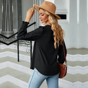 Elegant black jacquard long sleeve top featuring pleated cuffs and back view detail