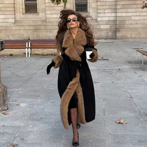 Elegant long black woolen coat with luxurious brown faux fur collar and cuffs