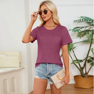 Detailed view of the purple smocked crew neck short sleeve t-shirt with pleated top design