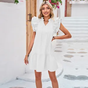 White sleeveless mini dress with ruffle flutter sleeves and tiered hem detail