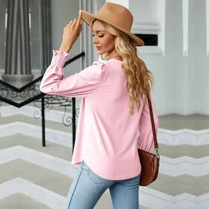 Detail of pink jacquard long sleeve T-shirt showing back fit and ruffled cuffs texture