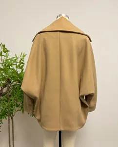 Detailed close-up back view of a camel wool blend short coat with stylish batwing sleeves