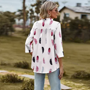 Back view of a white three-quarter sleeve blouse featuring colorful feather prints