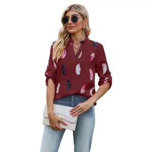 Elegant burgundy V-neck blouse with feather print and adjustable roll-tab sleeves