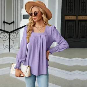 Detailed view of a lavender jacquard pleated square neck long sleeve top for women.