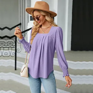 Detailed view of a lavender pleated square neck jacquard blouse with elegant smocked cuffs