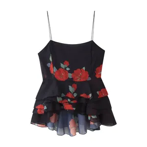 Detailed view of the red floral print on a black tiered ruffled camisole top
